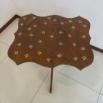 Wood side table designed with mother of pearl on top