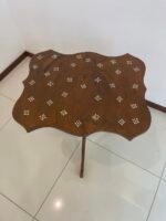 Wood side table designed with mother of pearl on top